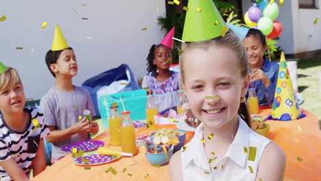 niños celebrando la fiesta de cumpleaños con animación de confeti sobre escena al aire libre