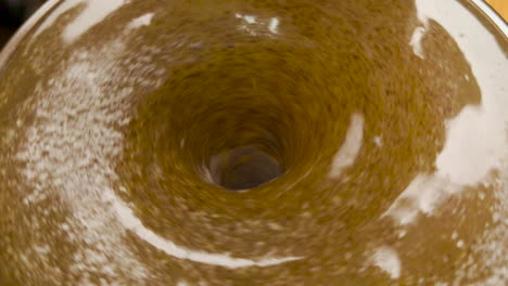 coffee mix and water in a self stirring coffee mug