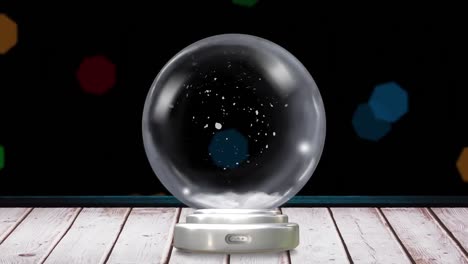 animation of christmas snow globe with snow flakes on black background