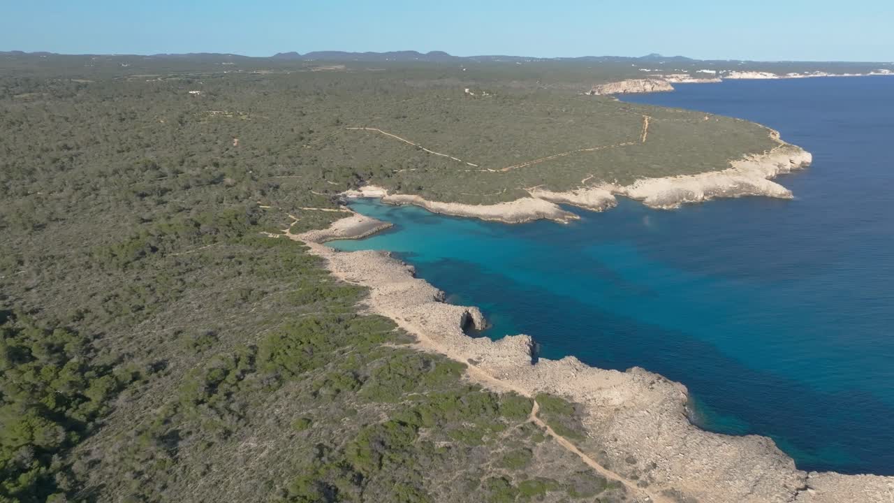 Es Talaier small picturesque cove beach Menorca island white sand turquoise water aerial Spain