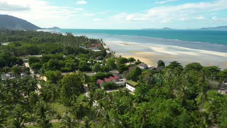 aerial footage of ko pha ngan island in southeast thailand renowned for its monthly full moon party, travel backpackers holiday destination