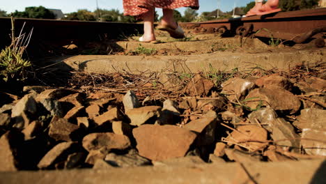 close relationship between mom and daughter - walk on tracks