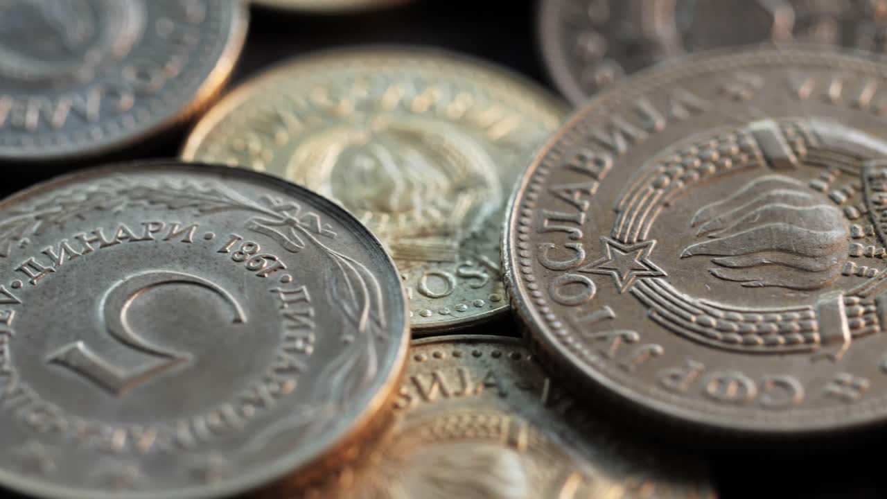Obsolete Yugoslav dinar and para coins with clear socialist emblem, macro rotating shot