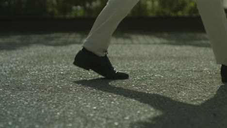 people walking on a paved surface