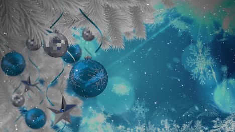 animation of snow falling over silver and blue christmas baubles decoration