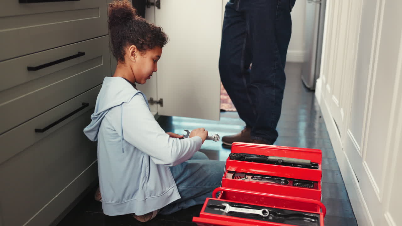 Girl using toolbox at home