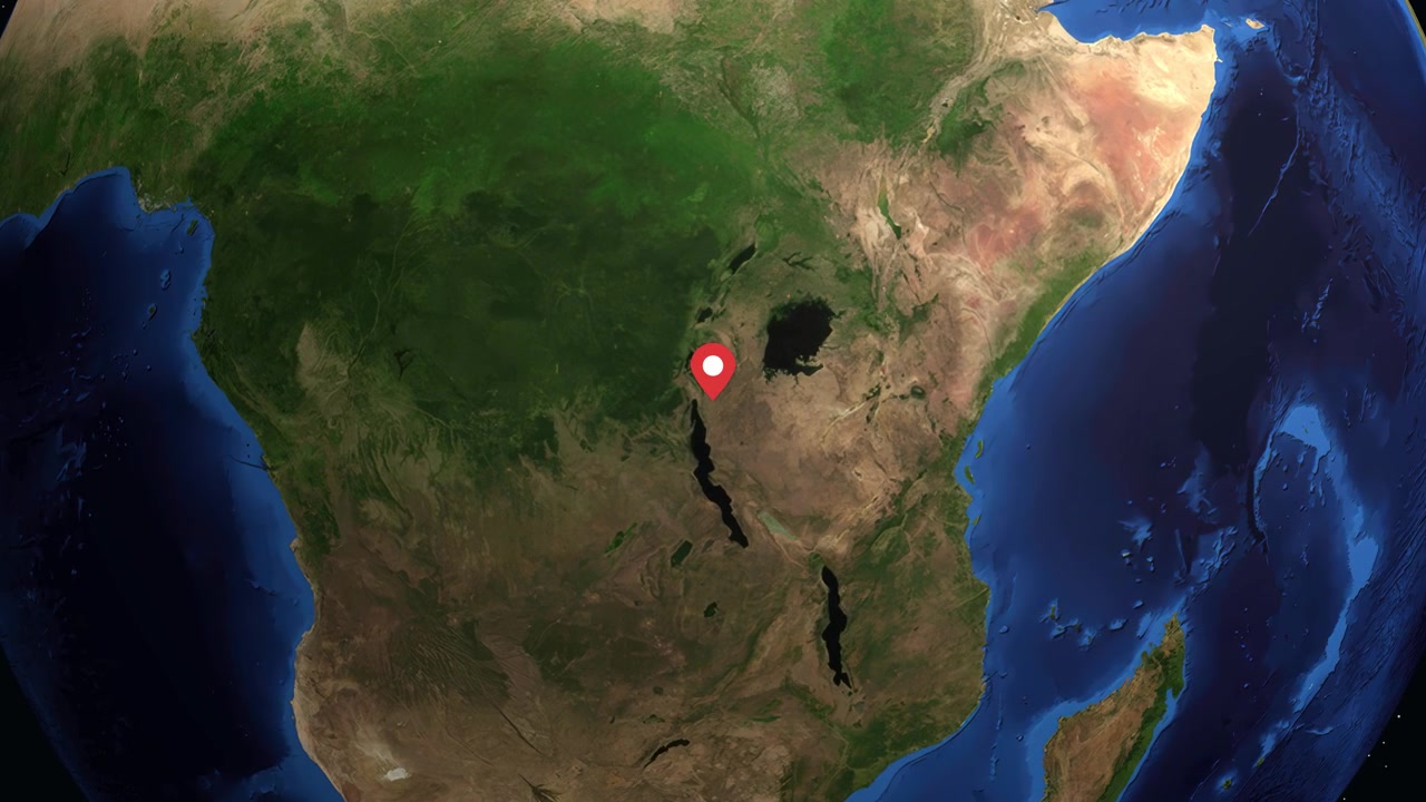 Globo digitale ruota e si ingrandisce su Gitega, Burundi, con sovrapposizione di dati su sfondo scuro.
