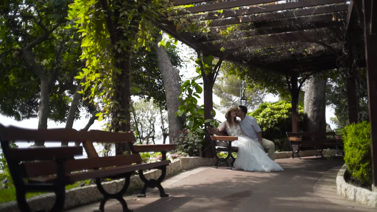 Couple Kissing in a Park Gazebo