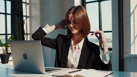 woman stretching in office