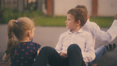 schoolboys-tired-of-preparing-for-tests-and-girl-on-pavement