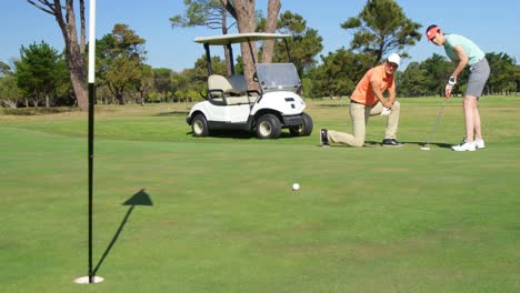 golfers playing golf