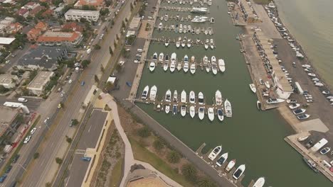 drone aerial over skate park in st kilda and showing boats parked in a boat yard bay in melbourne