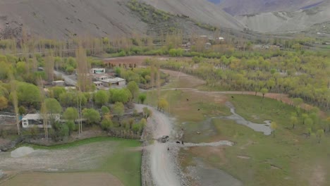 aerial over local ghizer valley village in pakistan