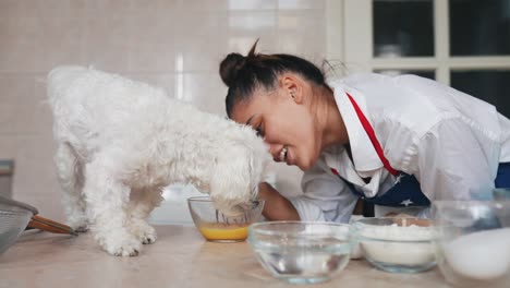 woman baking with her dog