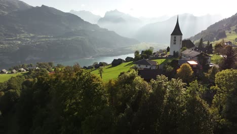 aerial view of a picturesque alpine village by a lake