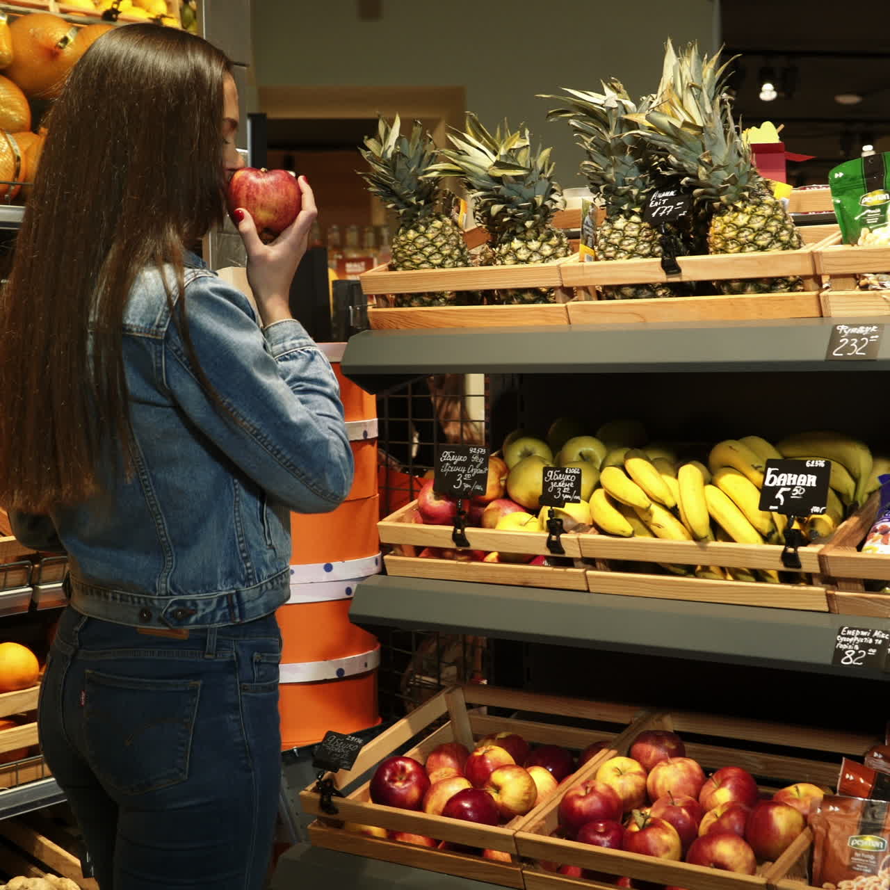Beautiful girl buying vegetables in organic shop at supermarket. Woman with a paper bag with fruit. Lifestyle. Healthy eating. Raw food. Square video