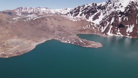 blue waters of the el yeso dam with