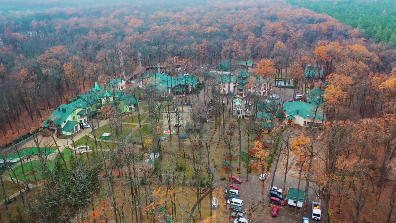 Residential complex between forests. Aerial view of luxury complex area surrounded by trees