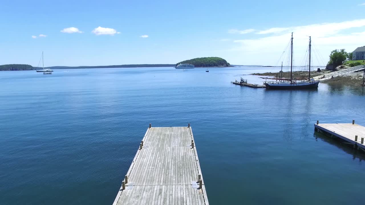 Drone Ocean Dock with Islands, Boats, and Large Ship