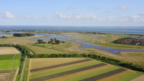 aerial high-altitude wide shot of the north sea and waterdunes - a nature area and recreational park in the province of zeeland, the netherlands