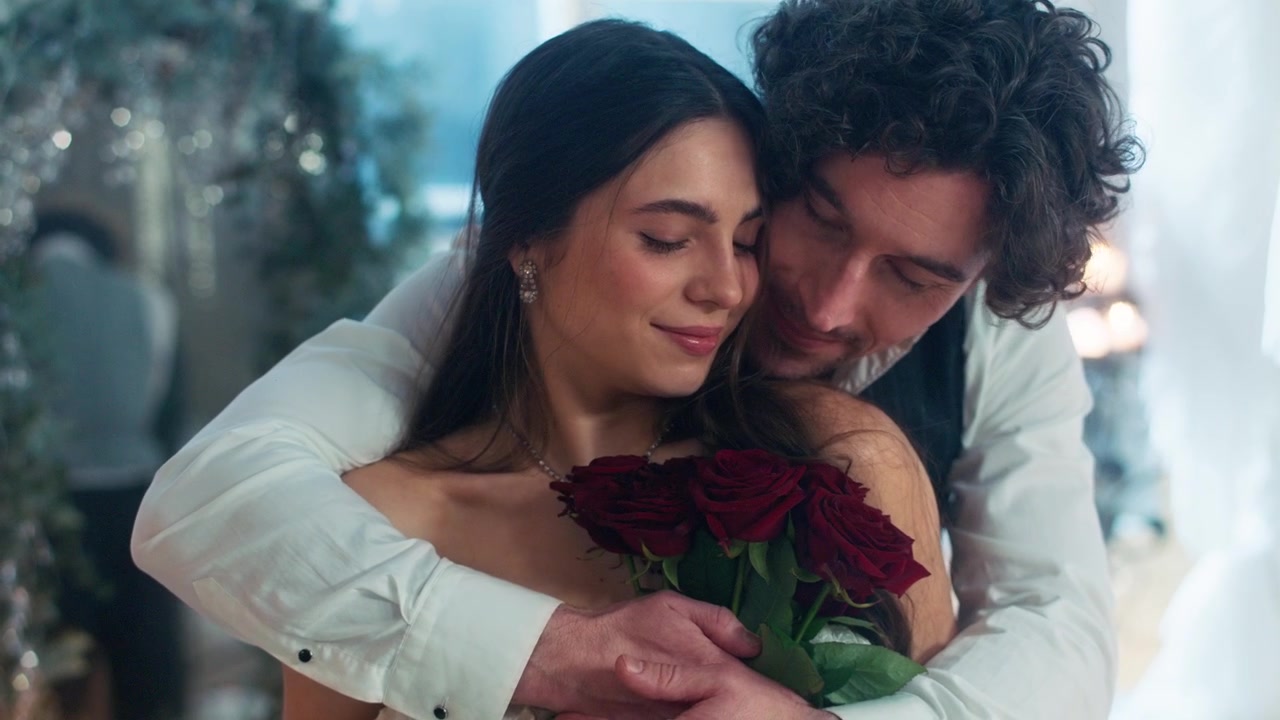 Romantic Couple Embracing, Woman Holding Red Roses