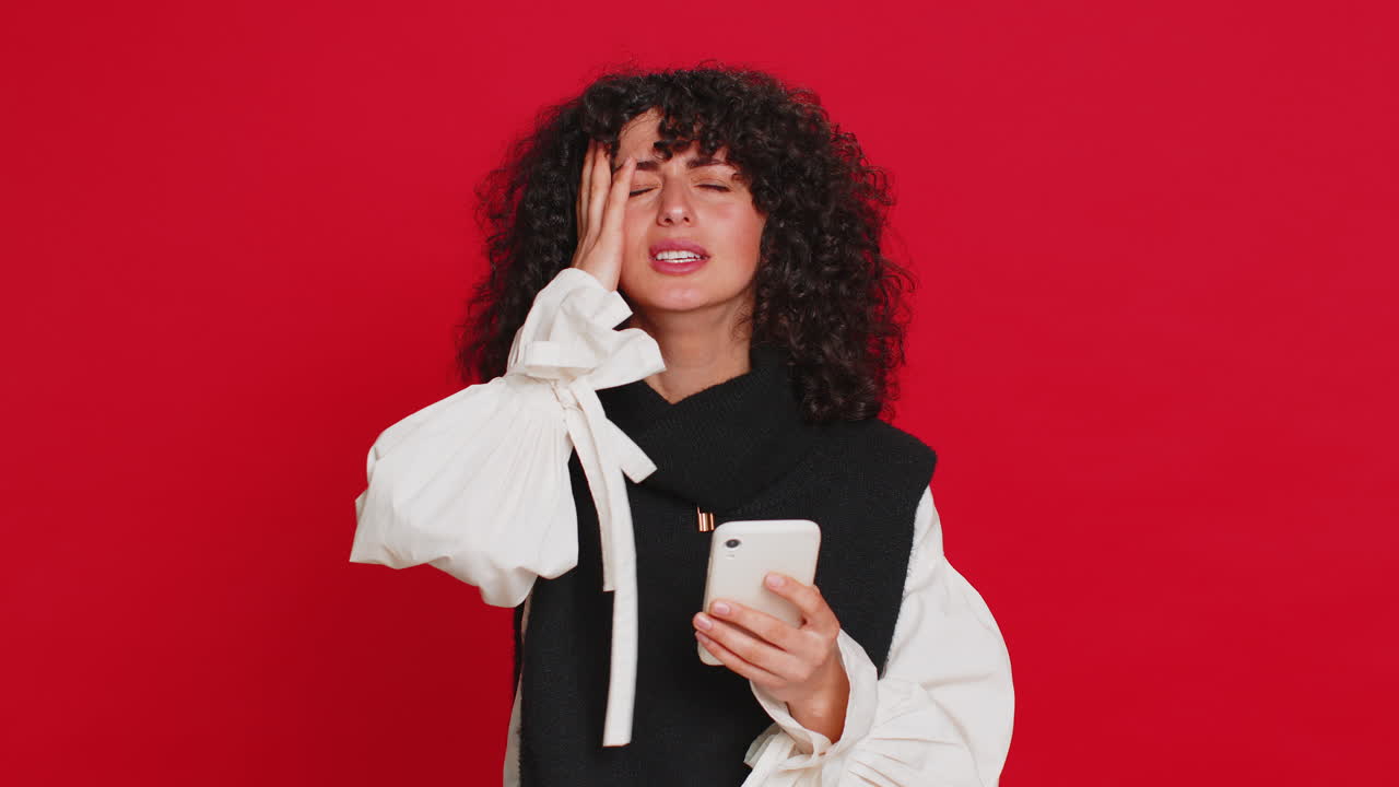 Upset sad woman use smartphone play game loses loss fail unlucky news bad lottery results crisis