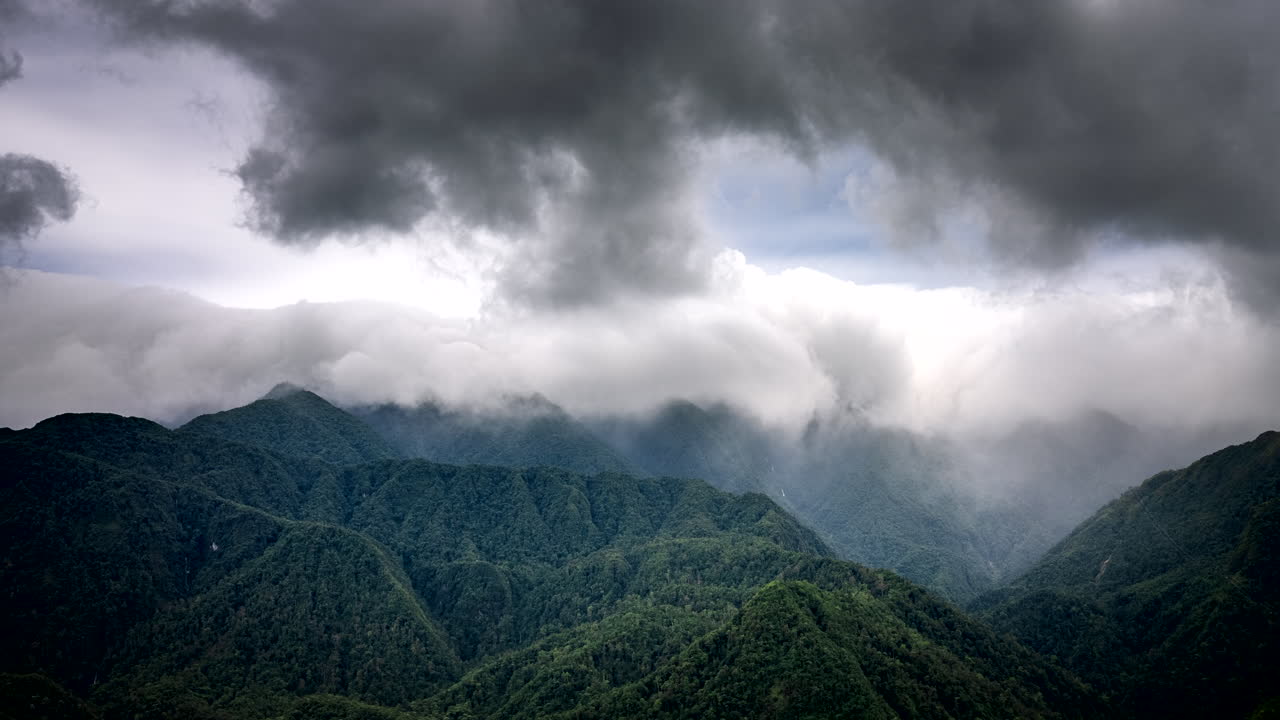 Mysterious rolling clouds over Sapa mountainous karst terrain, high time-lapse