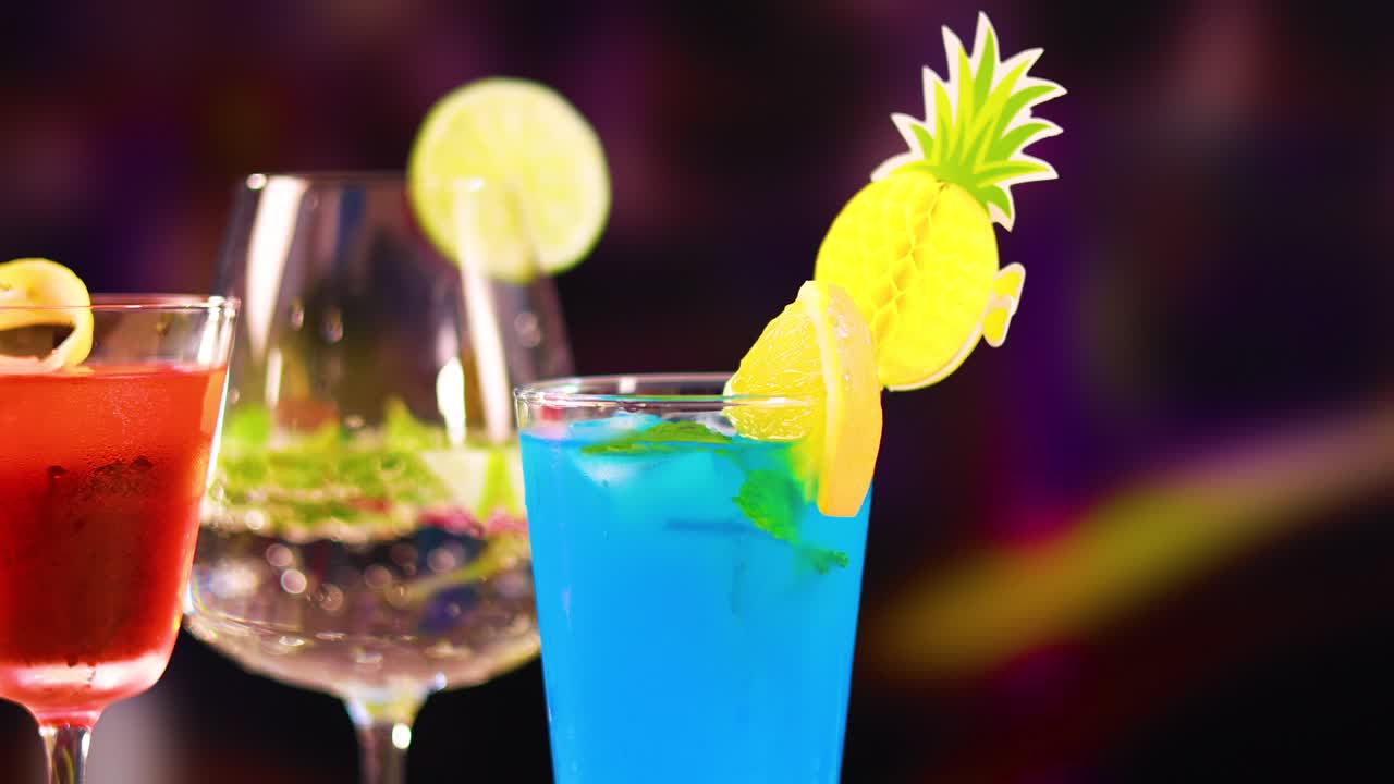 Three vibrant cocktails with garnishes in a lively bar atmosphere, featuring dynamic lighting and colorful backgrounds