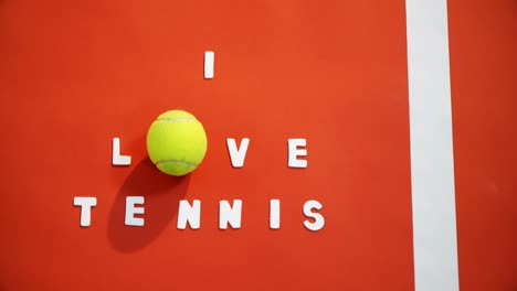 tennis ball with i love tennis text in court 4k