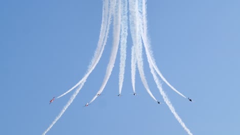 incredible shot of snowbirds aerobatic team breaking up the formation