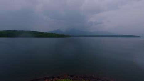 beautiful, atmospheric summer time-lapse of a lake in the appalachian mountains during a stormy, rainy day