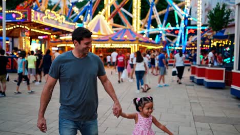 father and daughter at the amusement park