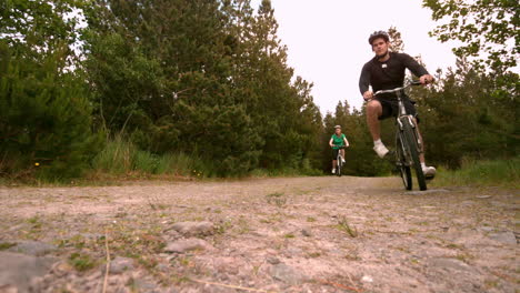 Athletic-couple-mountain-biking-in-the-countryside-together