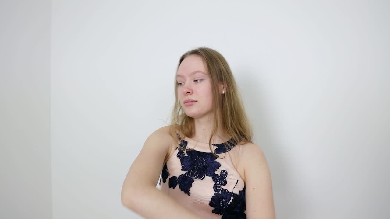 Sensual Thoughtfulness Female Dancer's Graceful White Room Performance