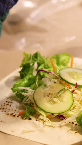 making a fresh kebab with vegetables and sauce