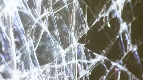 closeup of cracked glass illuminated by white light macro video closeup of cracked glass illuminated by white light macro video