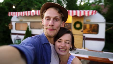 Young-Man-And-Woman-Recording-Video-For-Friends-Using-Smartphone-Or-Camera