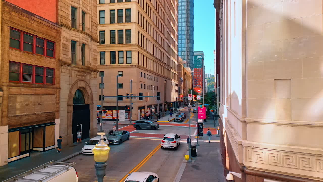 Piyysburgh, USA, 3 August 2025: Busy downtown street in Pittsburgh with cars. Urban street with cars and old buildings in central Pittsburgh