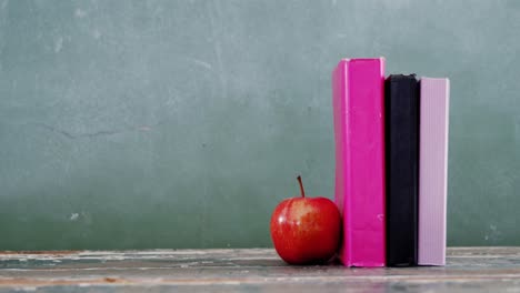 apple and book on table