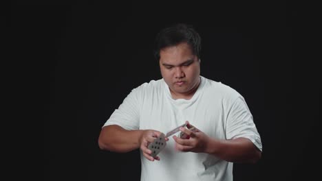 Asian Man Shows Trick With Playing Cards, Cardistry