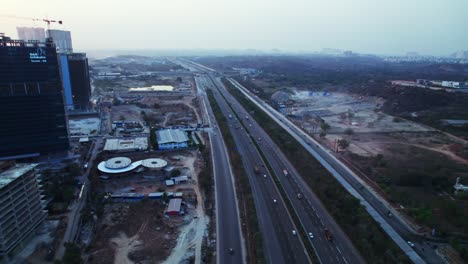 gar infobahn under construction building with outer ring road and concrete mining at day time, moving down shot, drone shot, 4k.