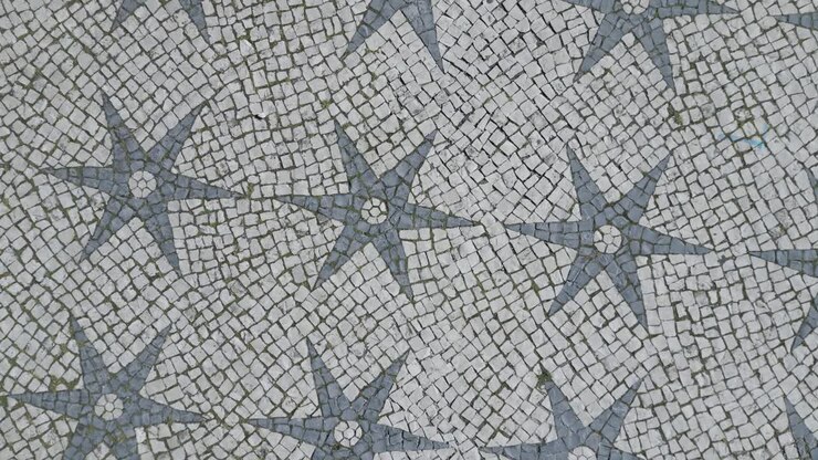 aerial orbit and cinematic soaring view of historical Lisbon mosaic, Portugal