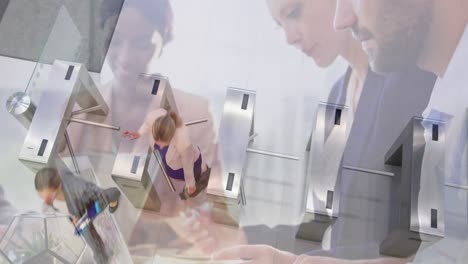 animation of diverse colleagues using laptops in office over commuters walking through turnstiles