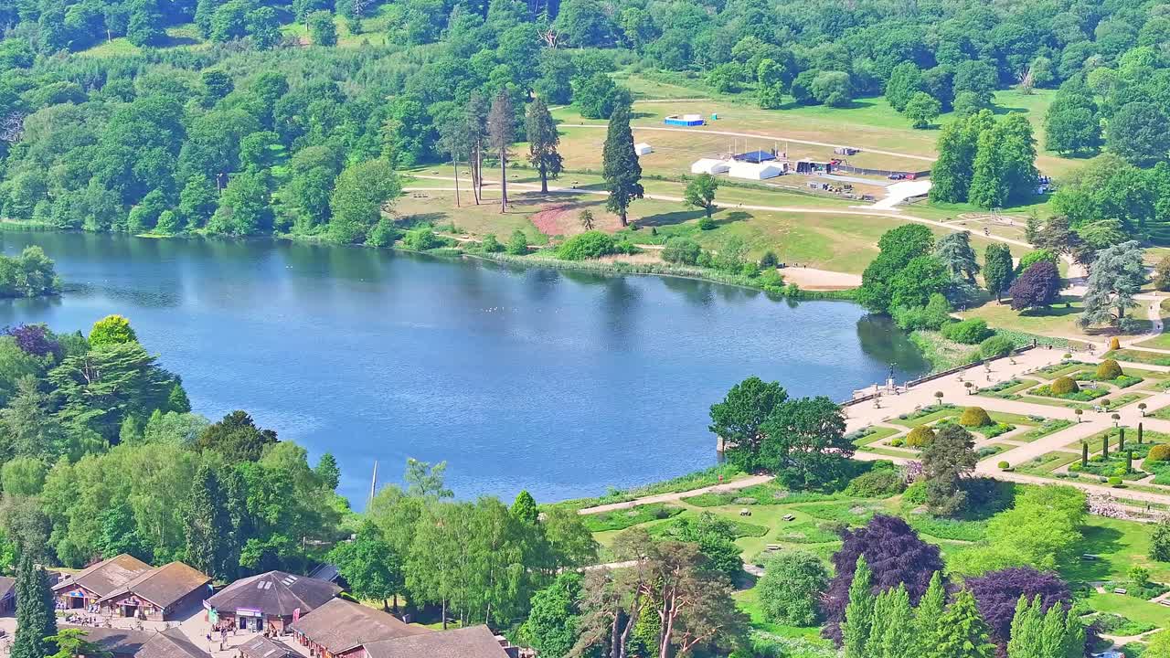 Aerial view of the tranquil blue lake beside the green Italian Gardens at Trentham on a clear sunny day, Staffordshire, UK.