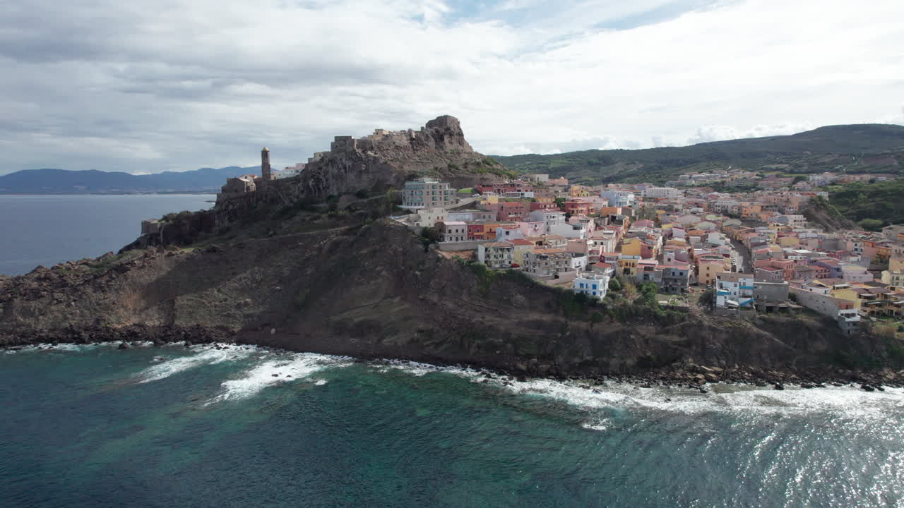city of Castelsardo, Certe&ntilde;a: aerial view in orbit over this impressive city of colorful houses and its historic tower