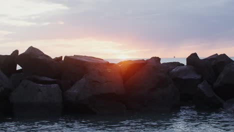 sunrise or sunset over rocky coastline