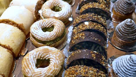 a variety of delicious pastries displayed in a bakery case