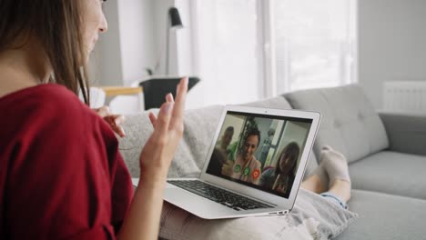 side view of video woman during video conference with friends