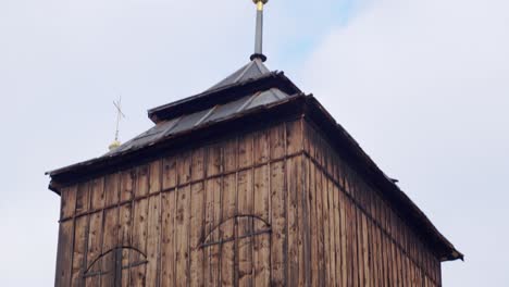 Close-view-of-the-wooden-windows-of-the-bell-tower,-Medium-panning-shot