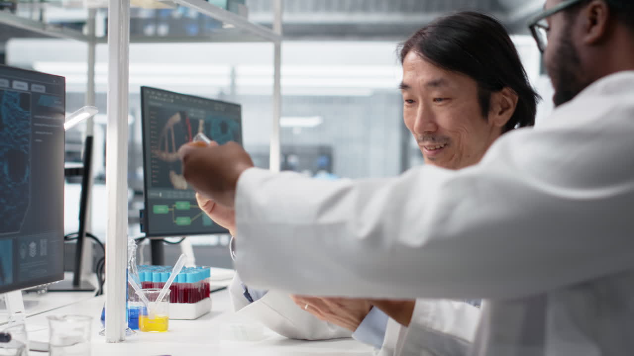 Multiracial Lab Engineers Inspect Liquids In Test Tube